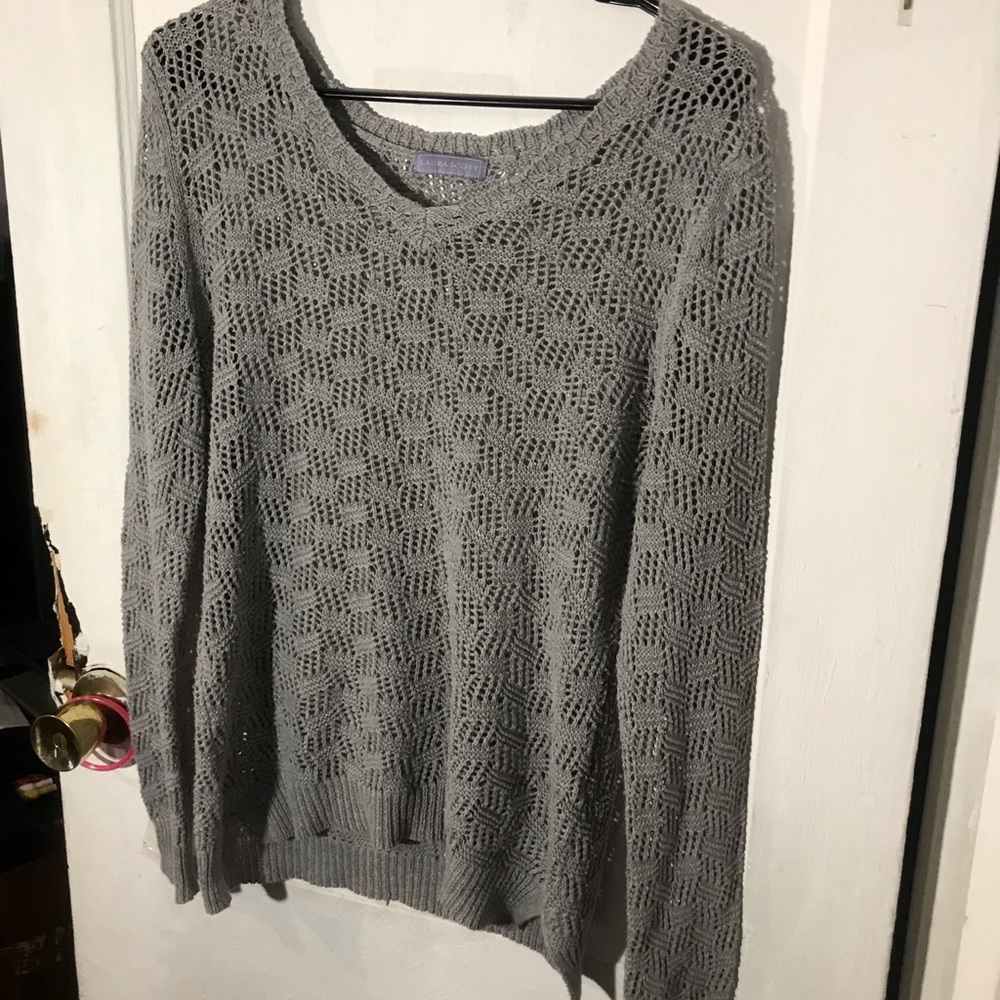 A grey knitted crew neck sweatshirt